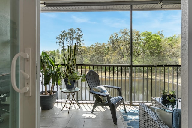 121 Grand Ravine Dr, Saint Augustine, FL 32086 - sunroom / solarium with a water view and view of wooded area