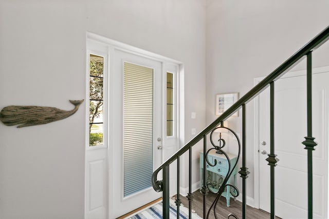 121 Grand Ravine Dr, Saint Augustine, FL 32086 - foyer entrance featuring stairs, wood finished floors, and baseboards