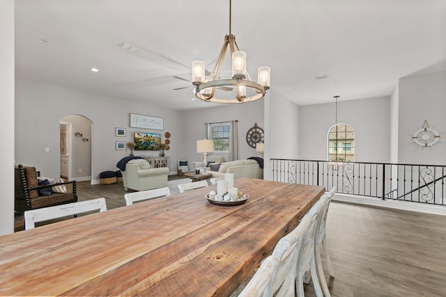121 Grand Ravine Dr, Saint Augustine, FL 32086 - dining area featuring a chandelier, wood finished floors, arched walkways, baseboards, and recessed lighting