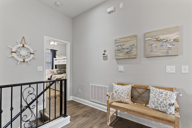 121 Grand Ravine Dr, Saint Augustine, FL 32086 - hallway with an upstairs landing, wood finished floors, and baseboards