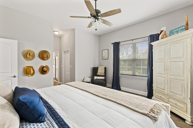 121 Grand Ravine Dr, Saint Augustine, FL 32086 - bedroom with baseboards, dark wood-type flooring, and a ceiling fan