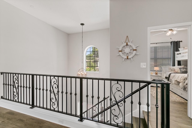 121 Grand Ravine Dr, Saint Augustine, FL 32086 - hall with a chandelier, wood finished floors, and an upstairs landing