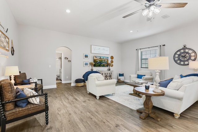 121 Grand Ravine Dr, Saint Augustine, FL 32086 - living area with arched walkways, a ceiling fan, wood finished floors, baseboards, and recessed lighting