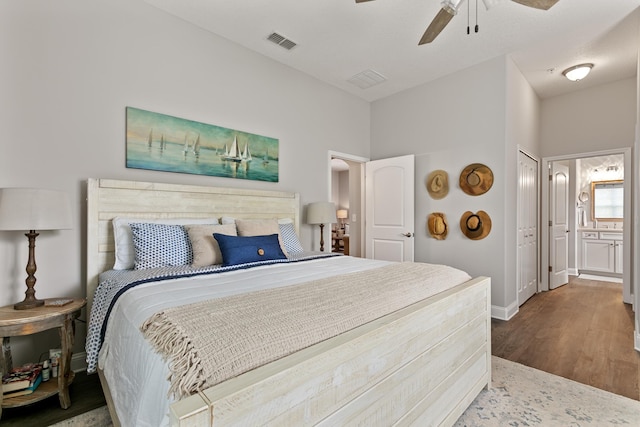 121 Grand Ravine Dr, Saint Augustine, FL 32086 - bedroom featuring wood finished floors, baseboards, ensuite bath, and ceiling fan
