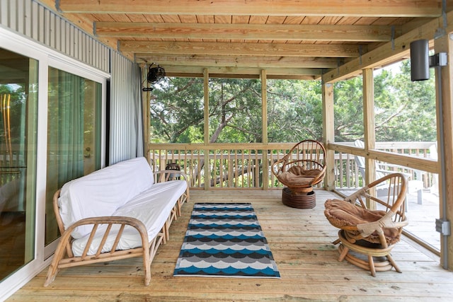 sunroom featuring beam ceiling and wooden ceiling