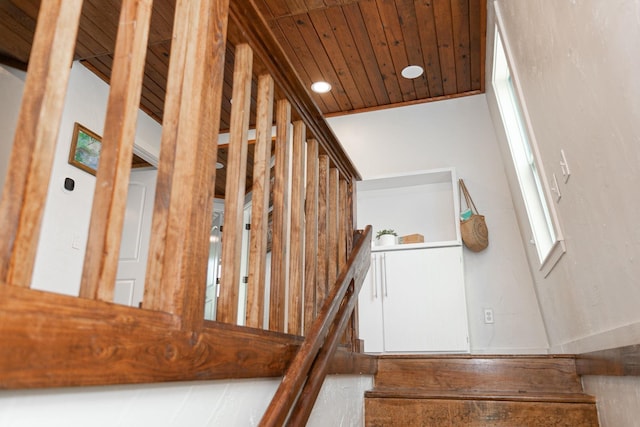 stairway with wood ceiling and vaulted ceiling