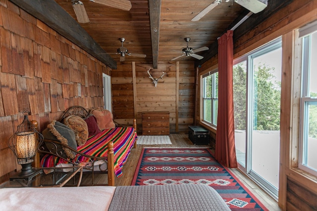 interior space featuring lofted ceiling with beams and wood ceiling