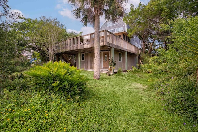 exterior space with a lawn and a wooden deck