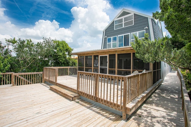 wooden terrace with a sunroom