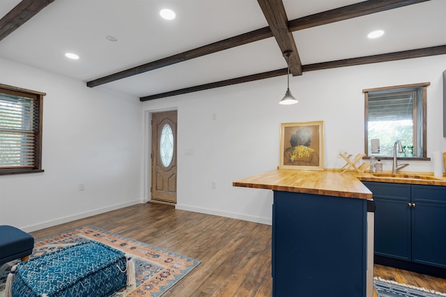 entryway featuring dark wood-type flooring, beamed ceiling, and sink