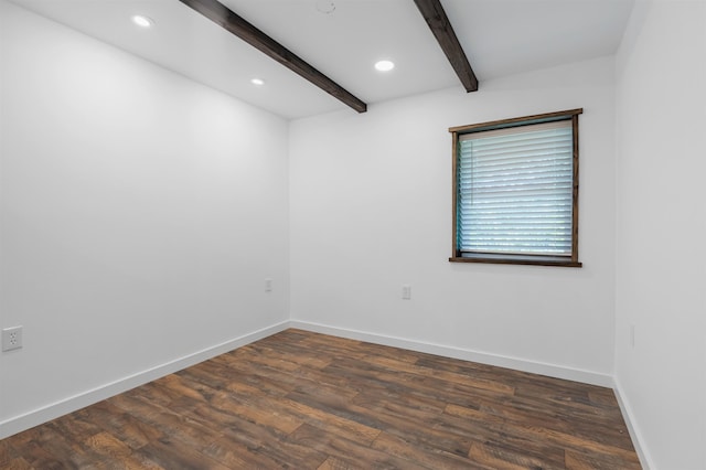 unfurnished room featuring beamed ceiling and dark wood-type flooring