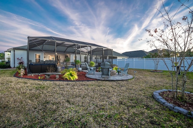 view of yard featuring a patio area and glass enclosure