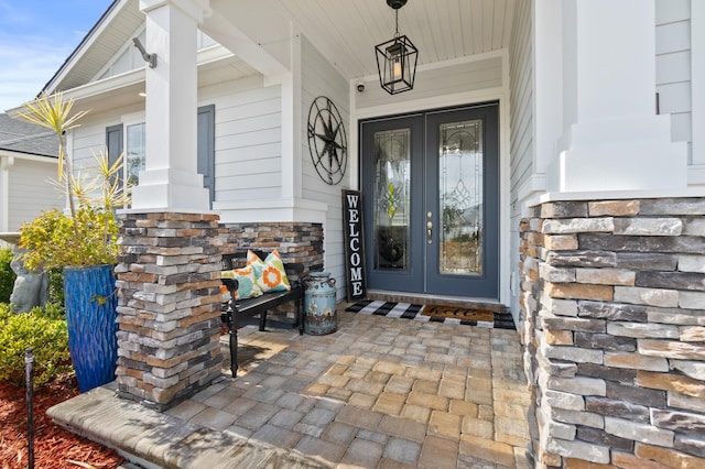 view of exterior entry featuring french doors