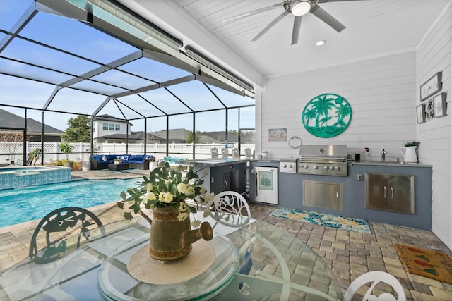 view of patio featuring a lanai, an outdoor kitchen, area for grilling, exterior bar, and a pool with hot tub