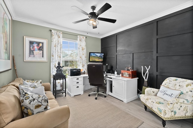 office space featuring ceiling fan, light hardwood / wood-style flooring, and ornamental molding