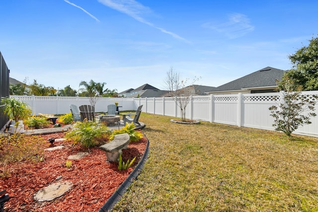 view of yard with a fire pit