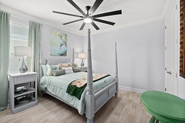 bedroom featuring light wood-type flooring, ceiling fan, and crown molding