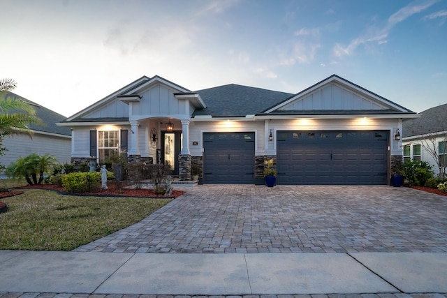 view of front of property featuring a garage and a front yard