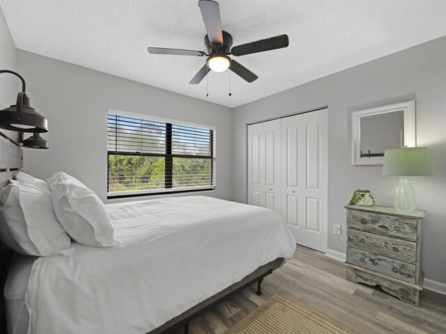 129 Rio Del Mar St Unit C, Saint Augustine, FL 32080 - bedroom featuring wood finished floors, a closet, baseboards, and ceiling fan