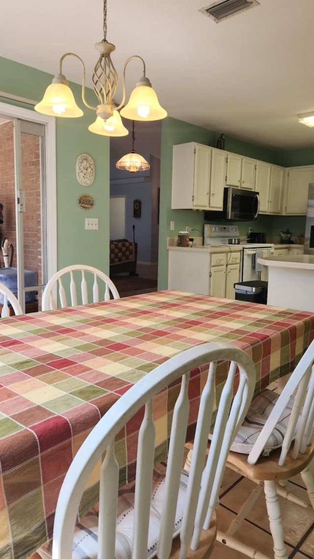 dining area featuring visible vents