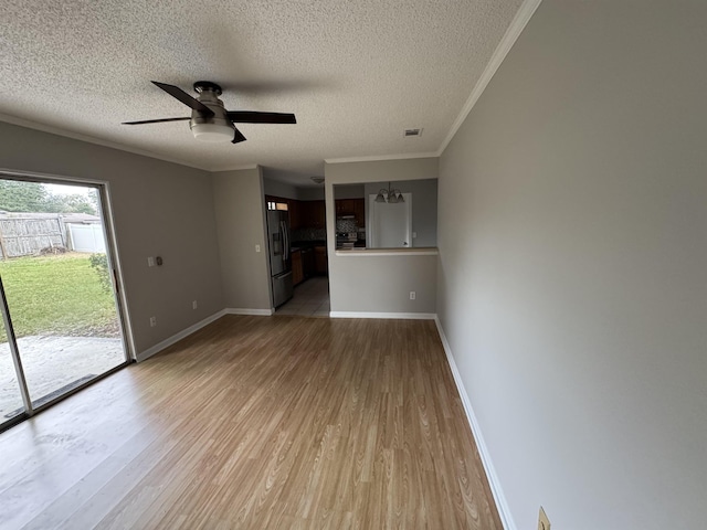 unfurnished living room featuring ceiling fan, crown molding, a textured ceiling, and light wood-type flooring