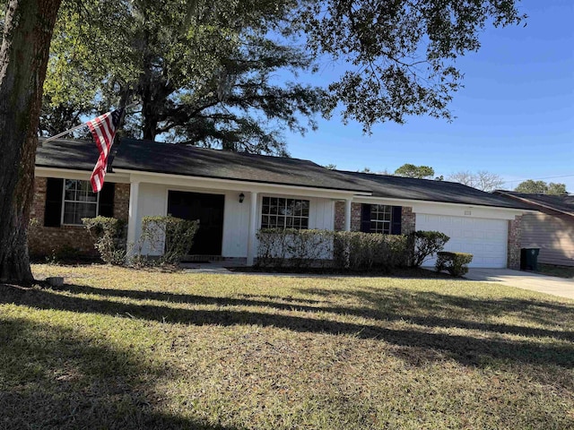 single story home with a garage and a front yard