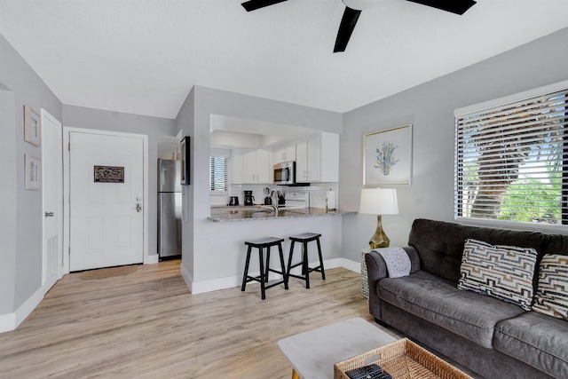 4250 A1A S B36, Saint Augustine, FL 32080 - living area featuring a ceiling fan and light wood finished floors