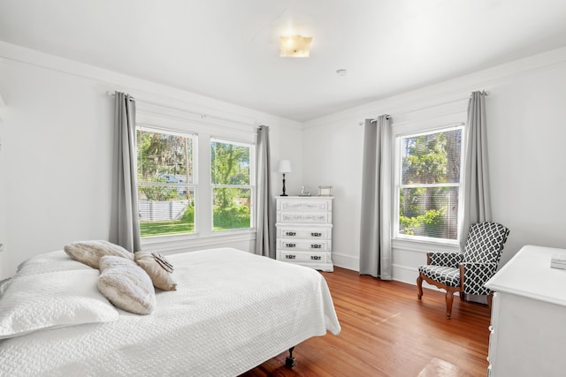 bedroom with hardwood / wood-style floors