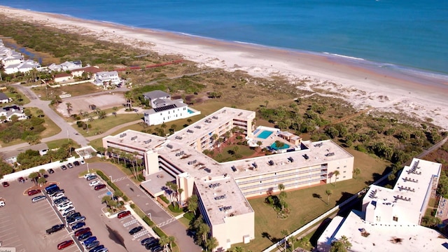 bird's eye view with a view of the beach and a water view