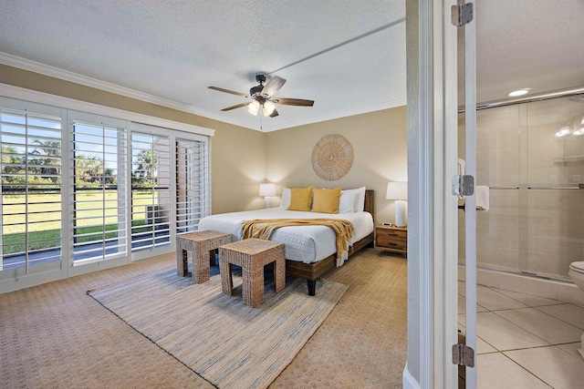 bedroom with ceiling fan, access to exterior, ornamental molding, and a textured ceiling