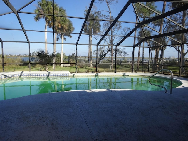 pool featuring a lanai and a patio area