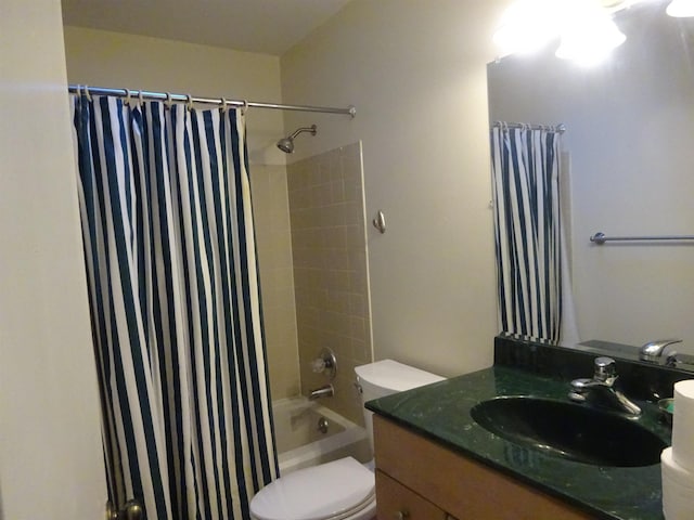 full bath featuring shower / tub combo, vanity, and toilet