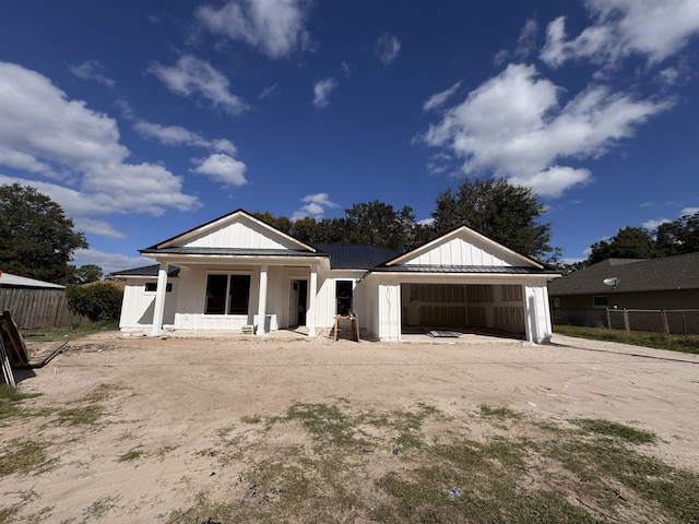 view of front of property featuring a porch and a garage