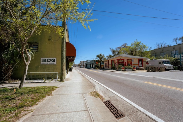 view of road featuring sidewalks and curbs