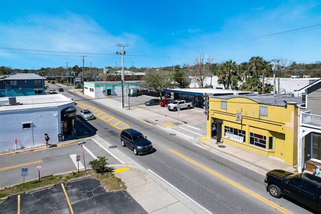 view of road with curbs and sidewalks