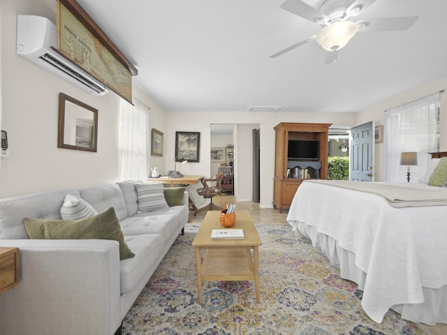 bedroom featuring light tile patterned floors, multiple windows, visible vents, and an AC wall unit
