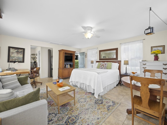 bedroom with visible vents, ceiling fan, and light tile patterned floors