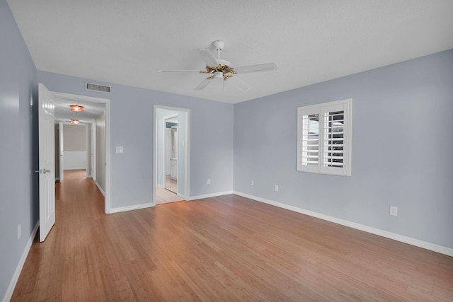 6 Versaggi Pl, Saint Augustine, FL 32080 - unfurnished bedroom featuring wood finished floors, a ceiling fan, and connected bathroom