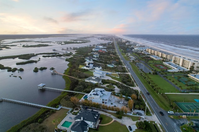 aerial view at dusk with a water view