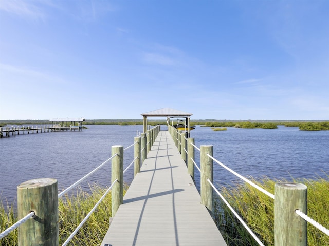 dock area featuring a water view