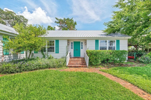 18 Ocean Ave, Saint Augustine, FL 32084 - view of front facade with a metal roof and entry steps