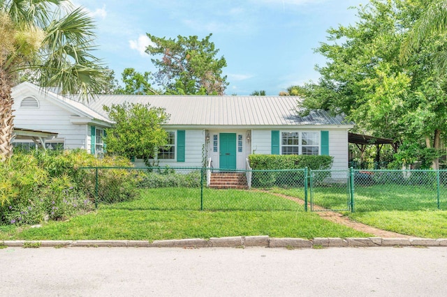18 Ocean Ave, Saint Augustine, FL 32084 - ranch-style house featuring a fenced front yard, a metal roof, an attached carport, and a gate