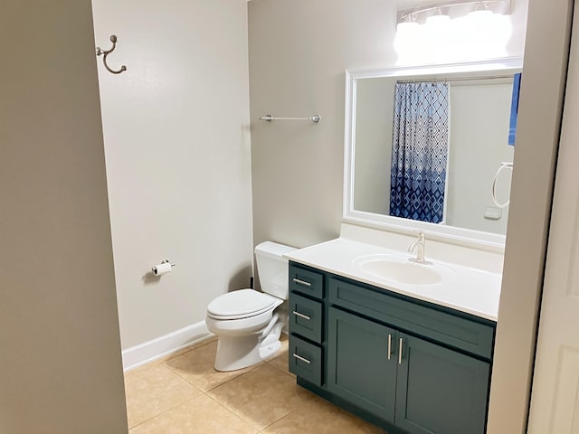 bathroom with tile patterned floors, vanity, and toilet