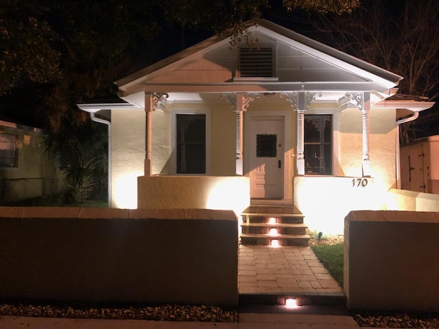 patio at twilight with covered porch