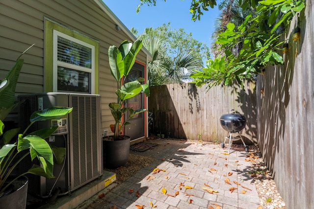 view of patio / terrace featuring central air condition unit and area for grilling