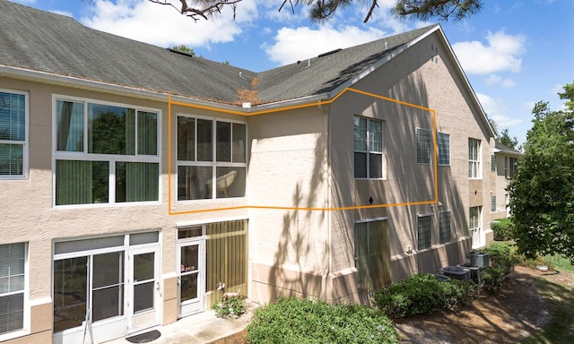 705 Augusta Cir, Saint Augustine, FL 32086 - view of home's exterior featuring stucco siding and a shingled roof
