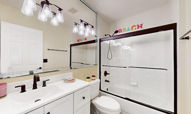 705 Augusta Cir, Saint Augustine, FL 32086 - bathroom featuring toilet, vanity, and enclosed tub / shower combo