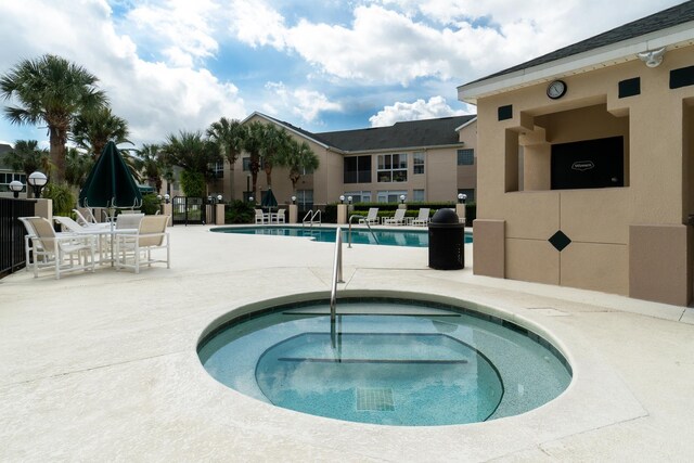 705 Augusta Cir, Saint Augustine, FL 32086 - community pool with a community hot tub and a patio