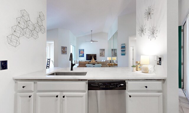 705 Augusta Cir, Saint Augustine, FL 32086 - kitchen with dishwasher, a sink, ceiling fan, lofted ceiling, and white cabinets