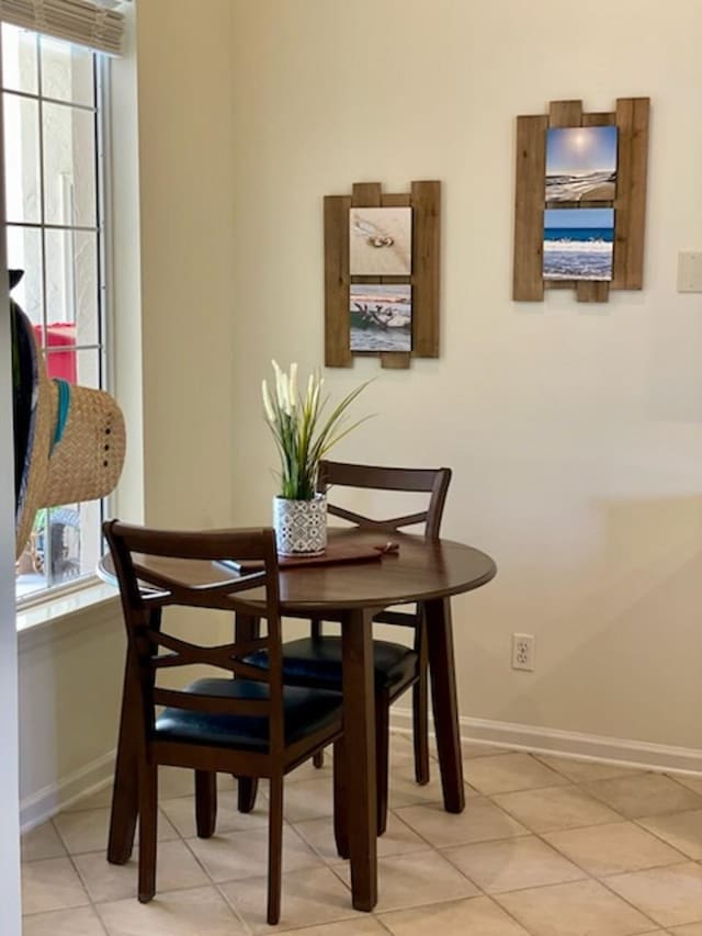 705 Augusta Cir, Saint Augustine, FL 32086 - dining space with healthy amount of natural light, baseboards, and light tile patterned floors